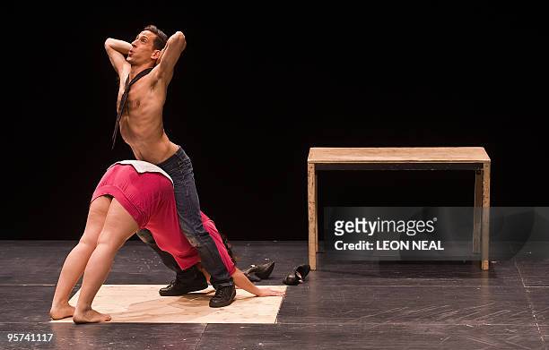 Eugenie Rebetez and Martin Zimmermann perform during a press preview of Zimmermann and de Perrot's "Oper Opis" mime performance at the Barbican...