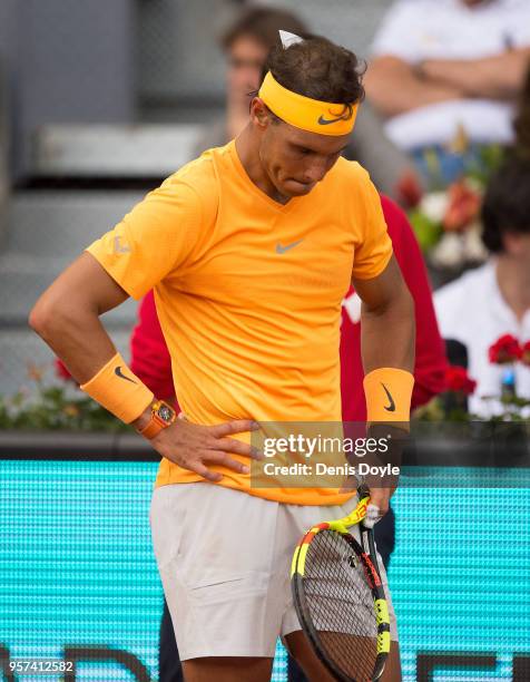 Rafael Nadal of Spain reacts after losing a point to Dominic Thiem of Austria during their quarterfinal match on day seven of Mutua Madrid Open at...