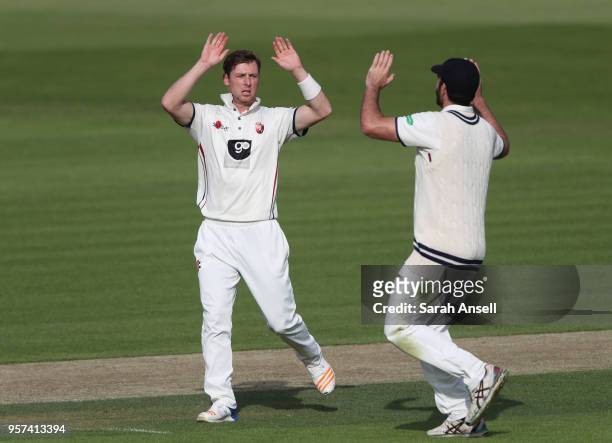 Matt Henry of Kent celebrates taking the wicket of Luke Wells of Sussex with teammate Grant Stewart during day 1 of the match between Kent and Sussex...