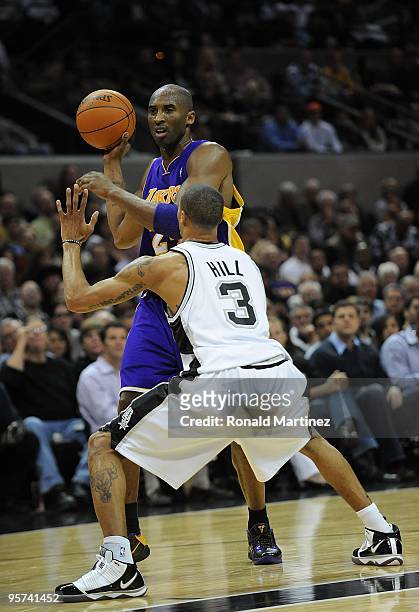 Guard Kobe Bryant of the Los Angeles Lakers is pressured by George Hill of the San Antonio Spurs on January 12, 2010 at AT&T Center in San Antonio,...