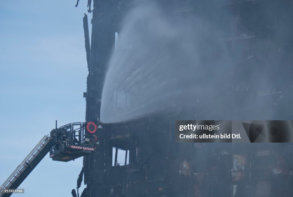 Fire brigade and community groups helping with fire disaster at  of Grenfell Tower in West London,UK. 14th June 2017.