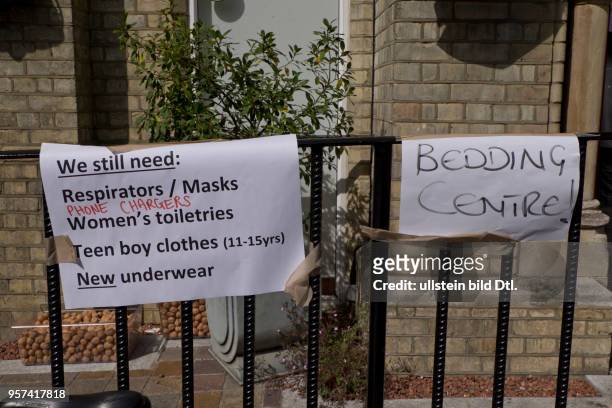 London,UK. 14th June 2017..Signs with tips on practical issues next to Grenfell Tower,London,UK.London,UK. 14th June 2017.© Julio Etchart/Alamy Live...