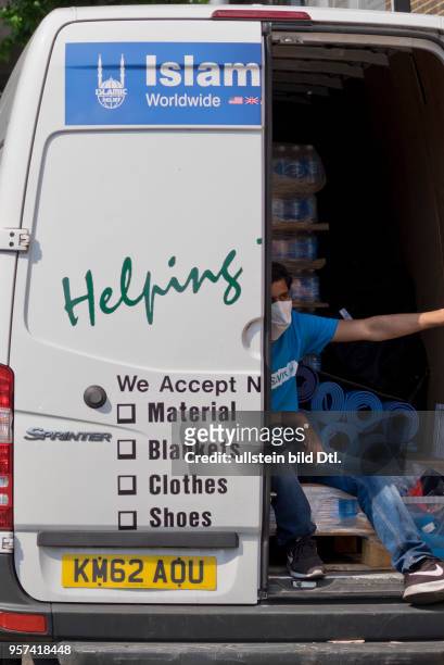 London,UK. 14th June 2017.Islamic Relief assistance van outside the Grenfell Tower,London,UK.© Julio Etchart/Alamy Live News