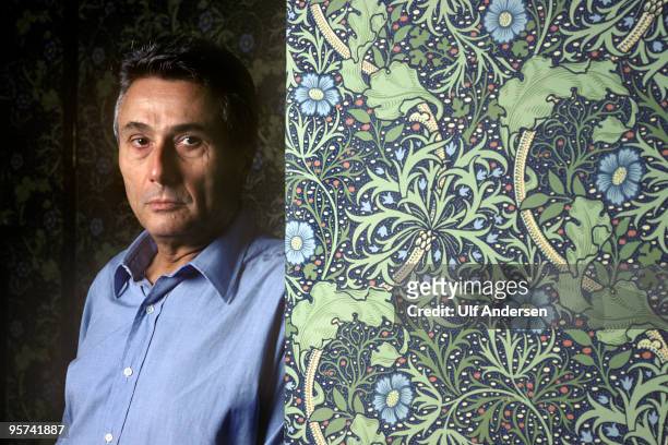 Italian writer Alberto Arbasino poses during a Portrait Session held at his home on October 19, 1988 in Rome, Italy.