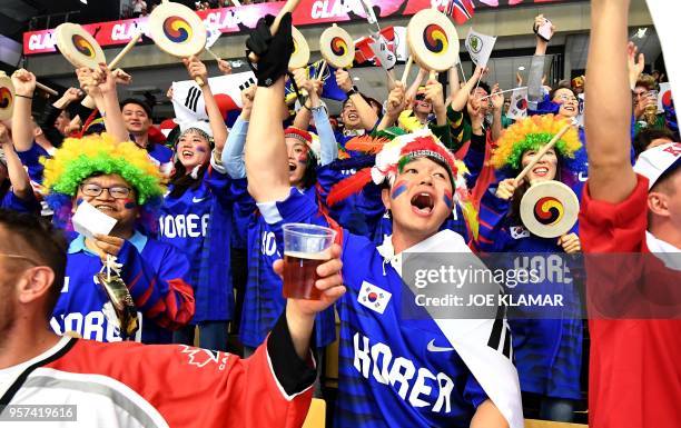 South Korean ice hockey fans celebrate their team's goal to 1:0 during the group B match USA vs South Korea of the 2018 IIHF Ice Hockey World...