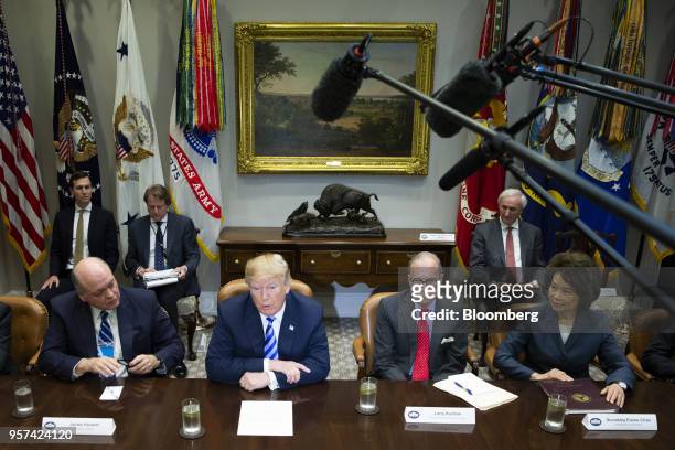 President Donald Trump, center, speaks while Jim Hackett, president and chief executive officer of Ford Motor Co., from left, Larry Kudlow, director...