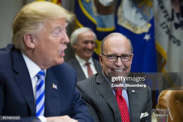 Larry Kudlow, director of the U.S. National Economic Council, right, reacts while U.S. President Donald Trump speaks during a meeting with automotive...