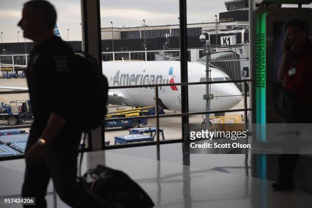 An American Airlines aricraft sits at a gate at O'Hare International Airport on May 11, 2018 in Chicago, Illinois. Today American Airlines held a...