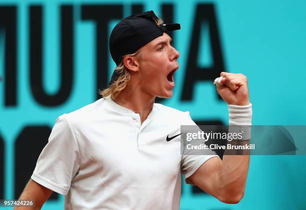 Denis Shapvalov of Canada celebrates in his singles match against Kyle Edmund of Great Britain during day seven of Mutua Madrid Open at La Caja...