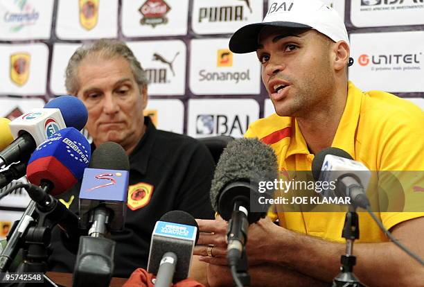 Angola's national football team captain Kali , flanked by Angola's national team football coach Manuel Jose, speaks during a press conference in...