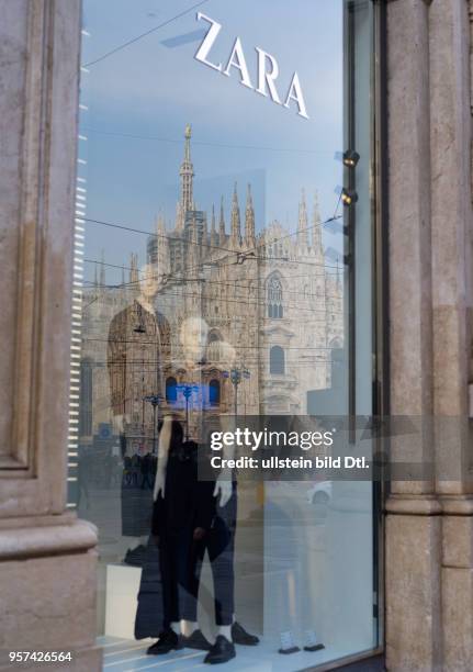 The cathedral Santa Mariae Nascenti in Milan is reflecting in a window pane of ZARA ,