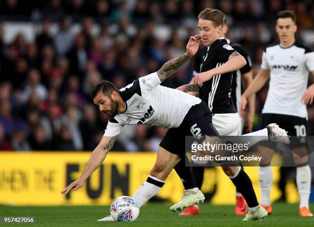 Bradley Johnson of Derby is challneged by Stefan Johansen of Fulham during the Sky Bet Championship Play Off Semi Final:First Leg match between Derby...