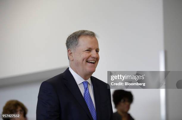 Doug Parker, chairman and chief executive officer of American Airlines Group Inc., smiles during an event to mark the opening of five new gates...
