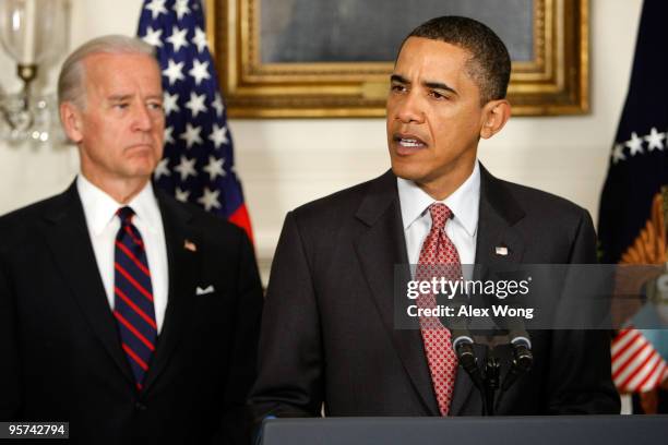 President Barack Obama makes a statement on the earthquake in Haiti as Vice President Joseph Biden looks on at the Diplomatic Reception Room of the...