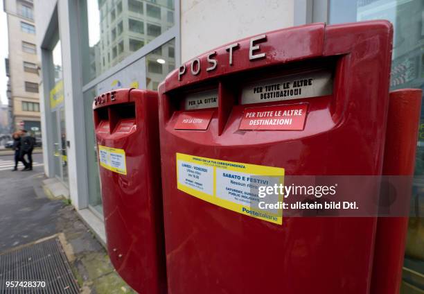 Mail boxes of the postal service Poste Italiane in Milan ,