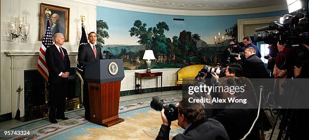 President Barack Obama makes a statement on the earthquake in Haiti as Vice President Joseph Biden looks on at the Diplomatic Reception Room of the...