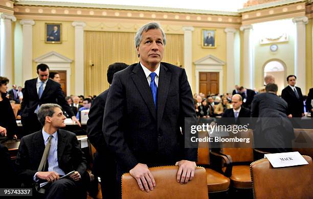 James "Jamie" Dimon, chairman, president, and chief executive officer of JPMorgan Chase & Co., center, waits for the start of a hearing before the...