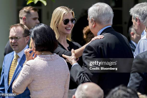 Ivanka Trump, assistant to U.S. President Donald Trump, center, talks to Senator Orrin Hatch, a Republican from Utah, while arriving to an event on...