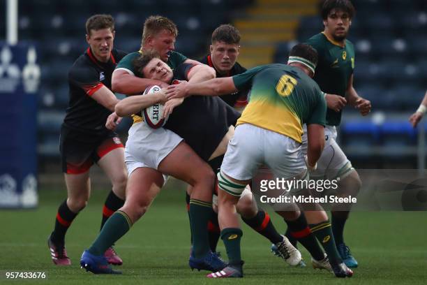 Aaron Hinkley of England is tackled by Daniel Jooste of South Africa during the International match between England U20's and South Africa U20's at...