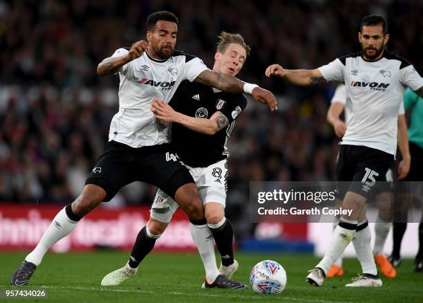 Stefan Johansen of Fulham is challenged by Tom Huddlestone of Derby County during the Sky Bet Championship Play Off Semi Final:First Leg match...