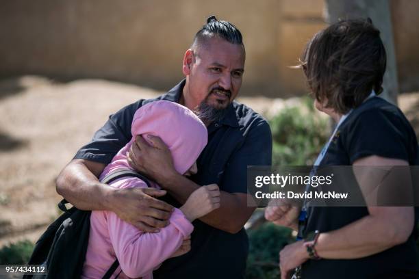 Student is reunited with friends and family after a shooting at Highland High School on May 11, 2018 in Palmdale, California. A 14-year-old male...