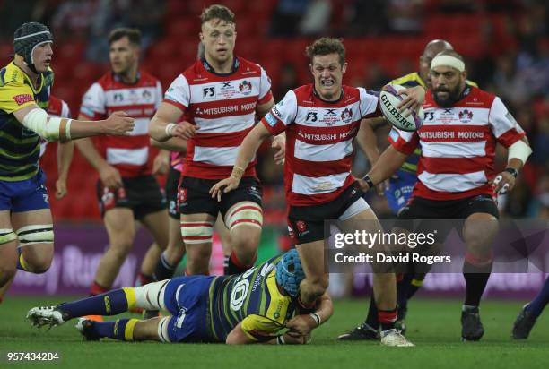 Billy Burns of Gloucester Rugby breaks through the Cardiff Blues defence during the European Rugby Challenge Cup Final match between Cardiff Blues...