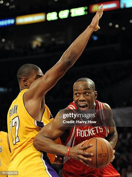 Carl Landry of the Houston Rockets ducks under the defense of Andrew Bynum of the Los Angeles Lakers during the second half at Staples Center on...