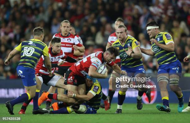 Mark Atkinson of Gloucester Rugby tries to break through the Cardiff Blues defence during the European Rugby Challenge Cup Final match between...