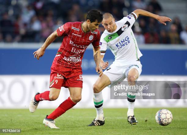 Kenneth Schuermans of OH Leuven in action with Hamdi Harbaoui of Zulte Waregem during the Belgian Playoff 2 tie between OH Leuven and Zulte Waregem...