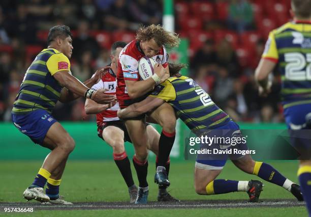 Billy Twelvetrees of Gloucester Rugby is tackled by Kristian Darcey of Cardiff Blues during the European Rugby Challenge Cup Final match between...