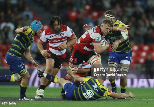 Ruan Ackermann of Gloucester Rugby breaks through the Cardiff Blues defence during the European Rugby Challenge Cup Final match between Cardiff Blues...