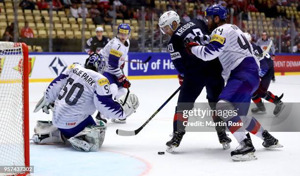 Chris Kreider of United States fails to socre over Sungje Park, goaltender of Korea battle for the puck during the 2018 IIHF Ice Hockey World...