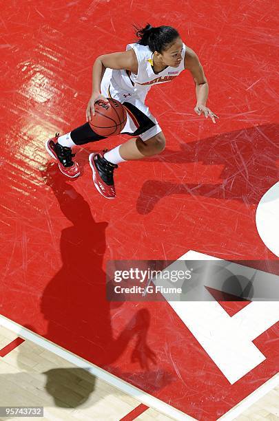 Jackie Nared of the Maryland Terrapins brings the ball up the court against the Loyola Greyhounds at the Comcast Center on December 6, 2009 in...