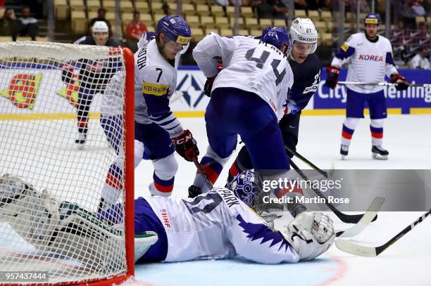 Anders Lee of United States fails to socre over Sungje Park, goaltender of Korea battle for the puck during the 2018 IIHF Ice Hockey World...