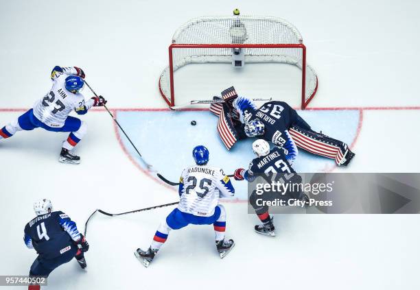 Jin Hui Ahn of Team Korea, Will Butcher of Team USA, Brock Radunske of Team Korea, Alec Martinez and Scott Darling of Team USA during the IIHF World...