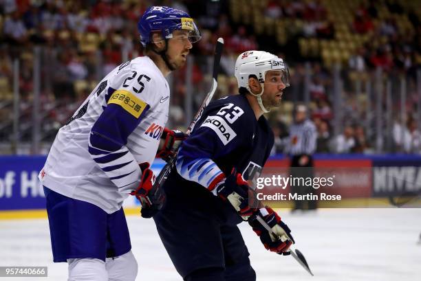 Alec Martinez of United States and Brock Radunske of Korea battle for position during the 2018 IIHF Ice Hockey World Championship group stage game...