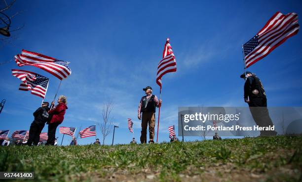 Members of the Patriot Guard line the entrance to Cross Insurance Center in Bangor on Monday, May 7 before the funeral service for Cpl. Eugene Cole.