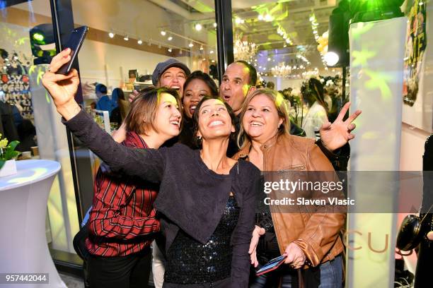 Marcus Lemonis pose with guests at the MARCUS meatpacking grand opening Event at Marcus Meat Packing on May 10, 2018 in New York City.