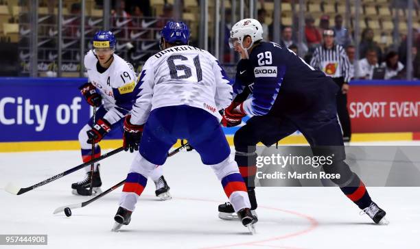 Tage Thompson of United States and Don Ku Lee of Korea battle for the puck during the 2018 IIHF Ice Hockey World Championship group stage game...