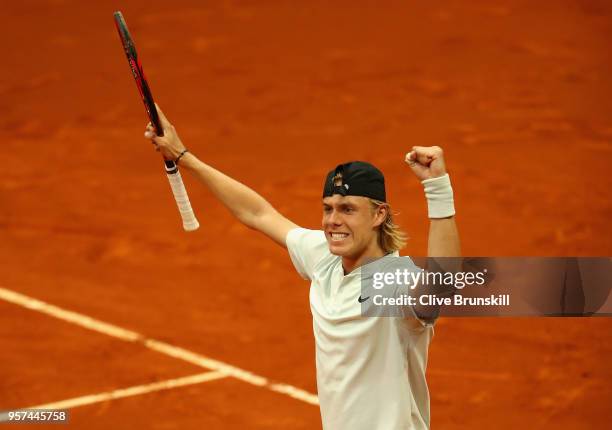 Denis Shapvalov of Canada celebrates match point against Kyle Edmund of Great Britain in their singles match during day seven of Mutua Madrid Open at...