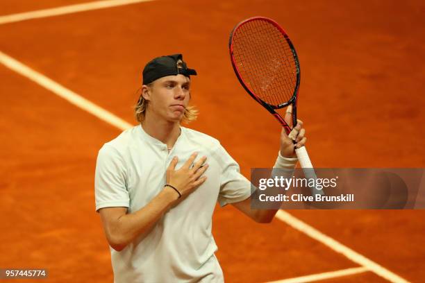 Denis Shapvalov of Canada celebrates match point against Kyle Edmund of Great Britain in their singles match during day seven of Mutua Madrid Open at...