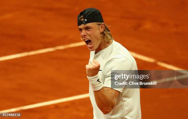Denis Shapvalov of Canada celebrates match point against Kyle Edmund of Great Britain in their singles match during day seven of Mutua Madrid Open at...