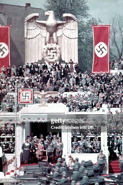 Parade of the Wehrmacht on Hitler's 50th birthday on the Ost-West-Achse in Berlin - view of the VIP box; behind Hitler, fr. The l: Hermann Göring,...