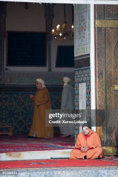 Muslim man in the religous mausoleum of Moulay Idriss in medina old city of Fez, Morocco 9th November 2008