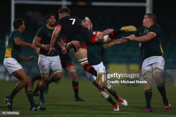 Aaron Hinkley of England is lifted off the ground as Tyrone Green of South Africa makes a tackle during the International match between England U20's...