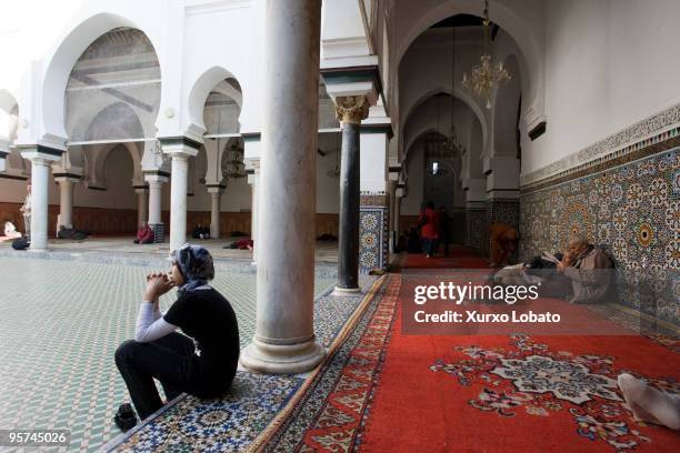 Young women in the religous mausoleum of Moulay Idriss in medina old city of Fez, Morocco 9th November 2008