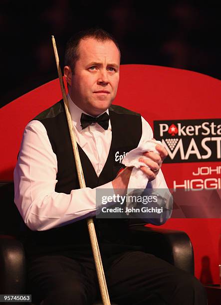 John Higgins of Scotland looks dejected in his match against Mark Allen of Ireland during the PokerStars Masters snooker tournament at Wembley Arena...