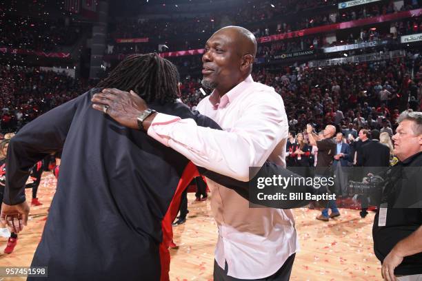 Hakeem Olajuwon hugs Nene of the Houston Rockets after the game against the Utah Jazz in Game Five of the Western Conference Semifinals of the 2018...