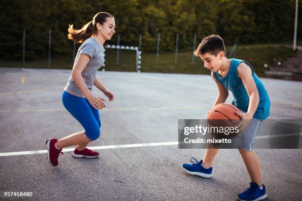 dribbling with my friends - boys basketball stock pictures, royalty-free photos & images