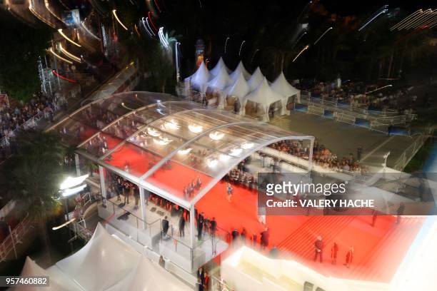 Eople arrive on May 11, 2018 for the screening of the film "Gongjak " at the 71st edition of the Cannes Film Festival in Cannes, southern France.